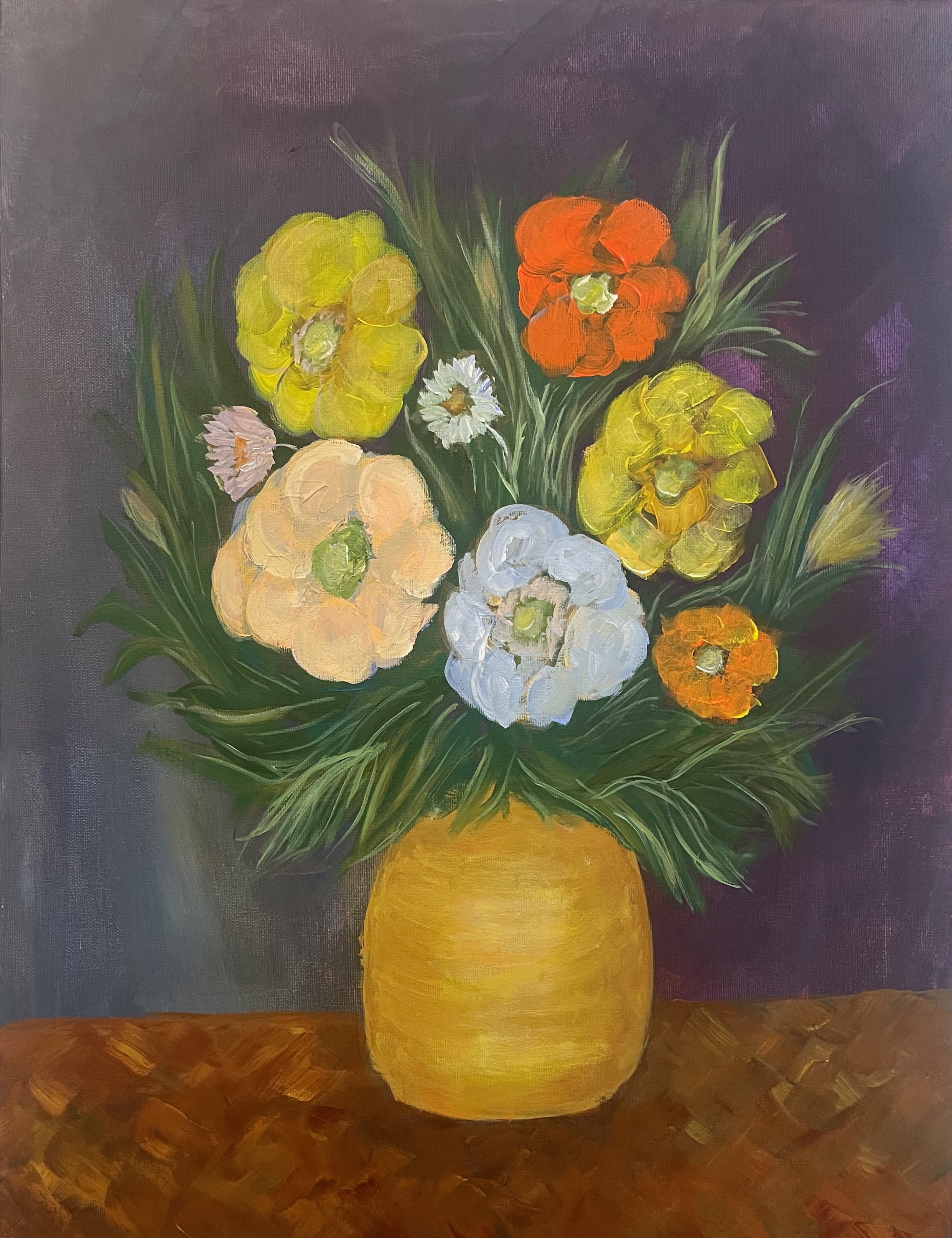 Colorful flowers in shades of yellow, orange, white and blue arranged in a golden vase against a purple background